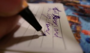 Writing with pen on paper