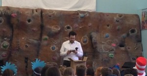 John Bray leading a school author talk in Perthshire with engaged children.